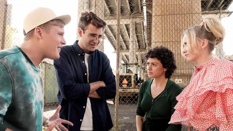 Elliott Drew Dory and Portia standing near a fence on Search Party