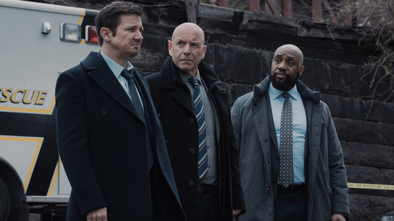 Mike, Ian, and Bunny stand outside the prison in Mayor of Kingstown