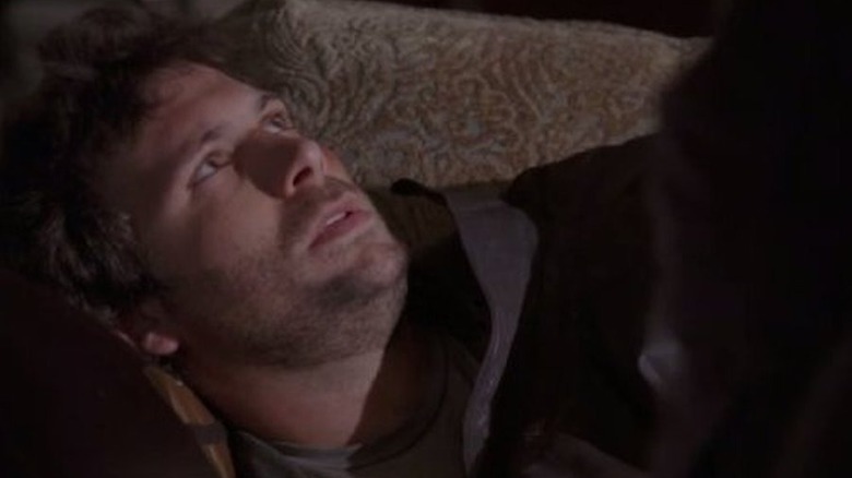 Knapp lays on a couch in Kidnapped