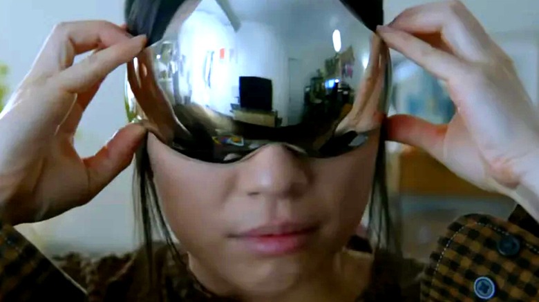 A woman putting on a VR headset in 3 Body Problem