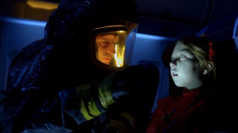 Dr. Ephraim Goodweather inspecting a corpse on a plane in The Strain