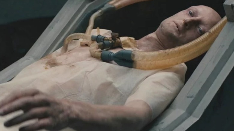 A human trapped in an alien machine in War of the Worlds (2019)