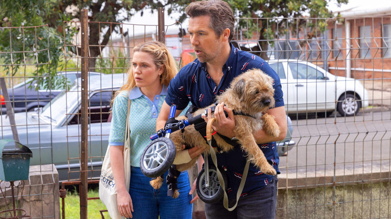 Ashley and Gordon holding Colin in Colin From Accounts