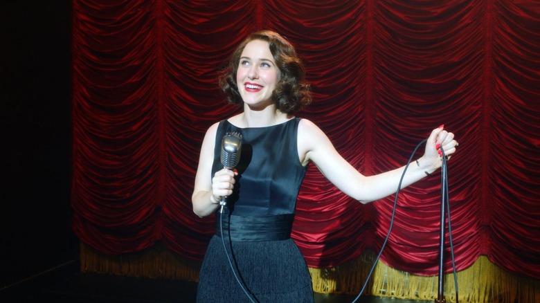 Midge performing a stand-up set in a black dress on The Marvelous Mrs. Maisel