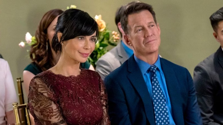 Cassie and Sam attending a wedding in "Good Witch."