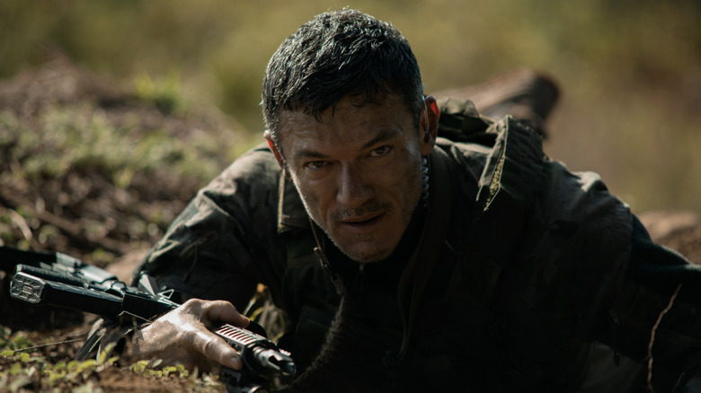 Bambi lays in the dirt with his rifle in Echo 3