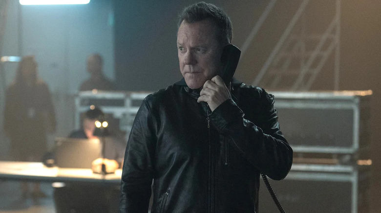 John talks on the phone in a bunker in Rabbit Hole