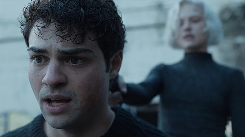 Nichka holds a gun to the back of Owen's head in The Recruit