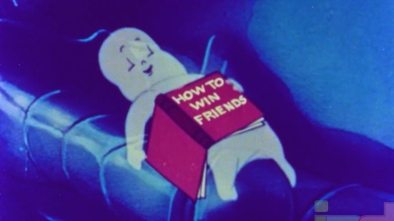 Casper lying down while reading "How to Win Friends" in "The Friendly Ghost"