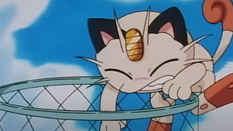 Meowth eating trash in "Pokémon: The Animated Series"