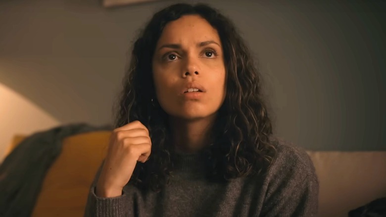 Georgina Campbell concerned sitting on a couch
