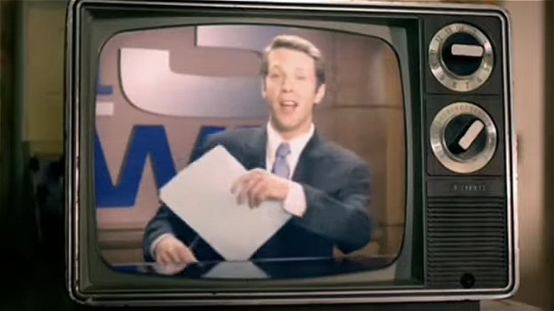 A news reporter reports news