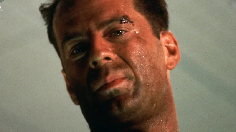 John McClane watches Hans fall