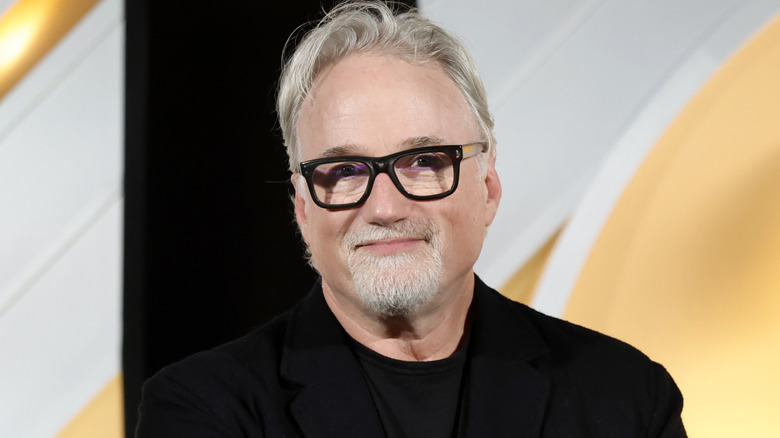 David Fincher smiling in a black shirt