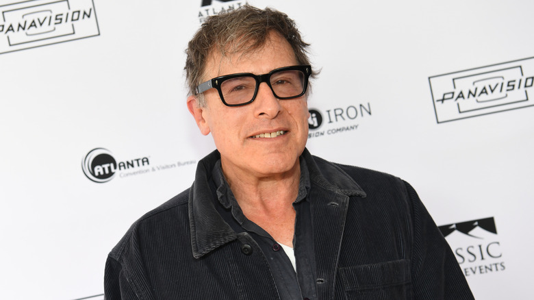 David O. Russell posing for photographers in 2025