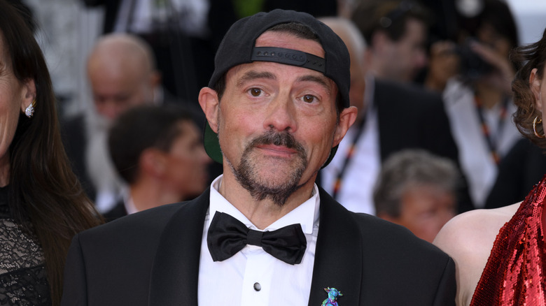 Kevin Smith wearing a tuxedo and baseball cap in 2025