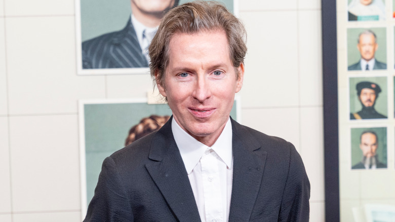 Wes Anderson smiling for photographers in 2025