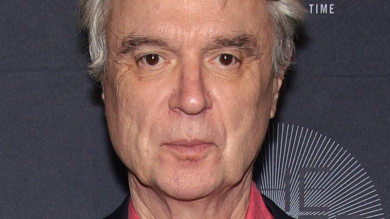 David Byrne in pink shirt