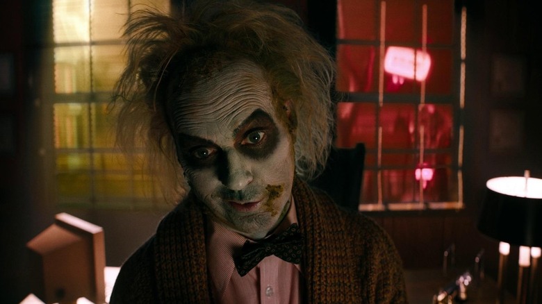 Beetlejuice with head cocked, wearing a bow tie and jacket in Beetlejuice Beetlejuice (2024)