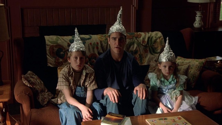 Merrill Hess and his nephew and niece protecting their heads in Signs (2002)