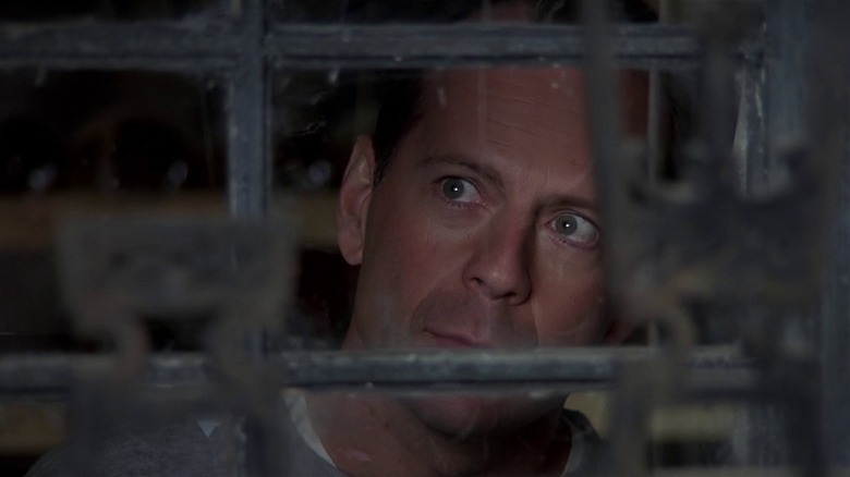Malcolm Crowe looking through a window in The Sixth Sense (1999)