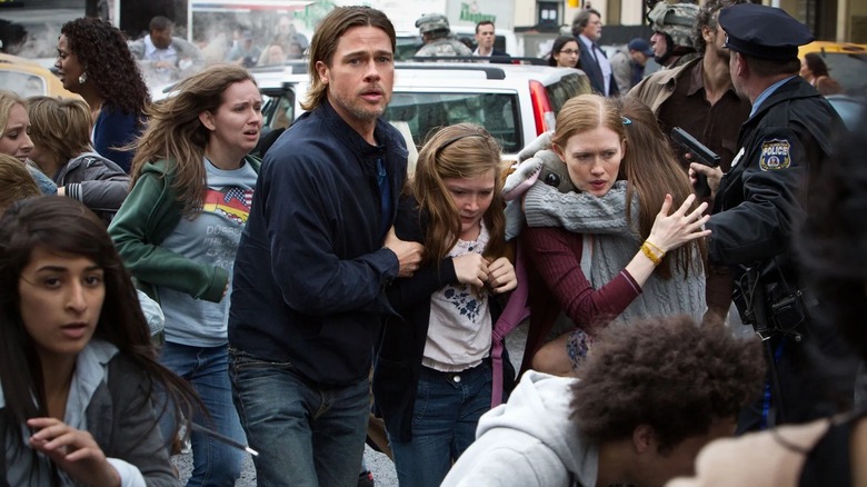 Gerry Lane and his family running from zombies in World War Z (2013)