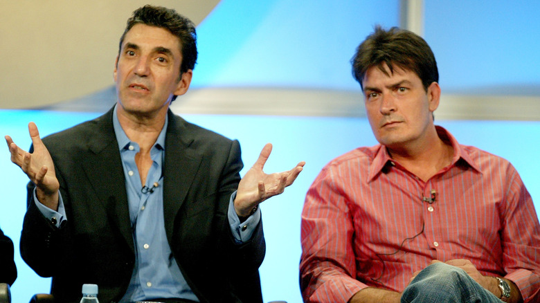 Chuck Lorre and actor Charlie Sheen talking on a "Two And A Half Men" panel