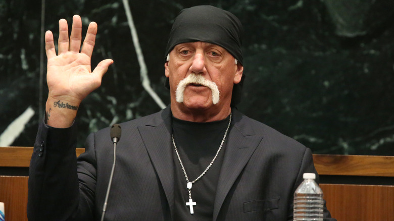 Hulk Hogan testifying in a courthouse as a witness in his civil suit against Gawker