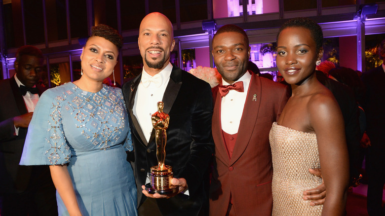 "Selma" director Ava DuVernay, Common, David Oyelowo, and Lupita N'yongo posing together at an Oscars afterparty