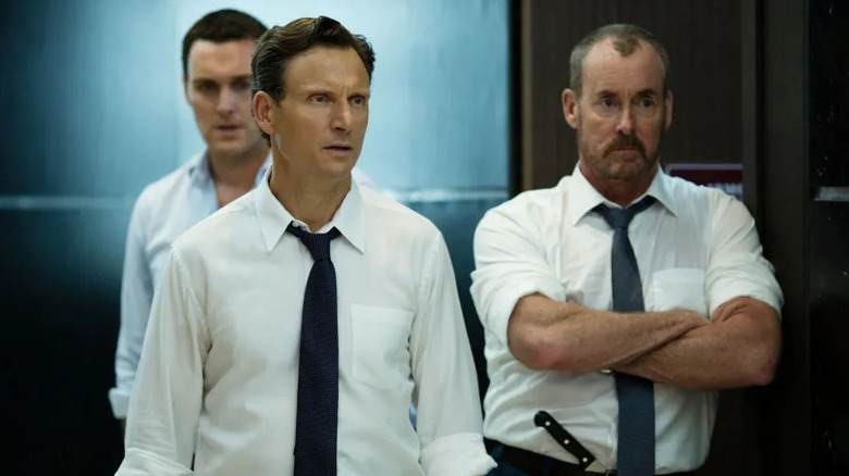 Three men in dress shirts and ties in "The Belko Experiment."