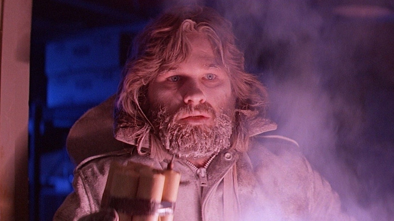 R. J. MacReady holding dynamite in "The Thing."