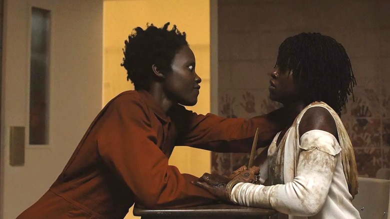 Adelaide and her Tethered clone at a desk in "Us."