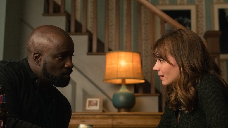 Father David and Kristen Bouchard talking in "Evil" (2019 - 2024)