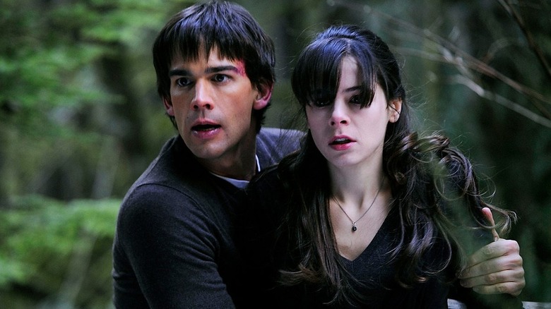 Henry and Abby confront something in the woods in "Harper's Island" (2009)