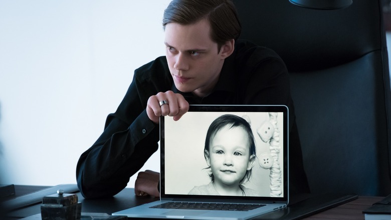 Roman shows a baby image in "Hemlock Grove" (2013-2015)