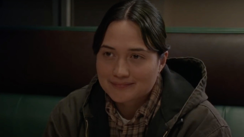 Jamie smiles in diner
