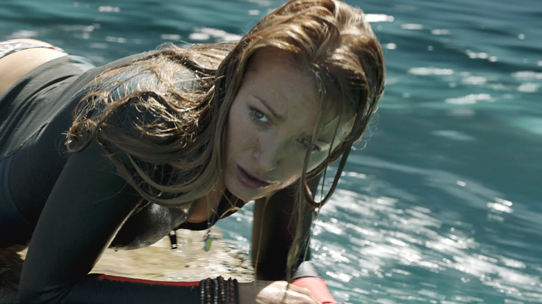 Nancy scared on a surfboard