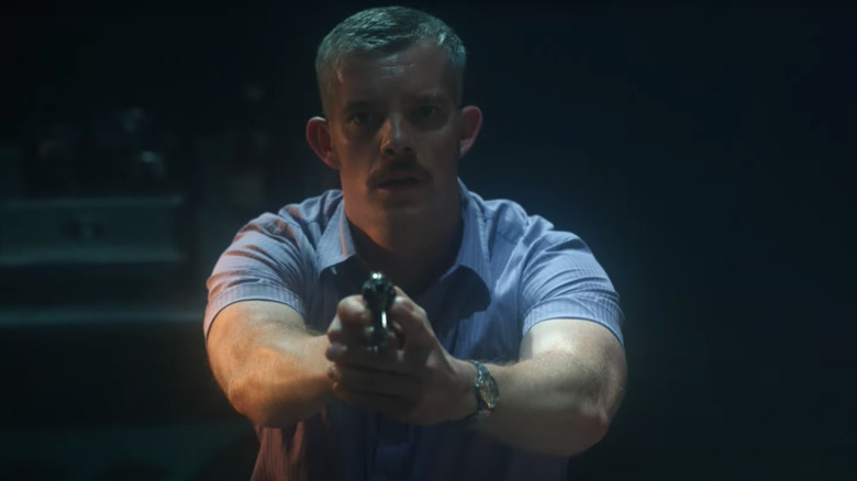 Patrick Read pointing pistol