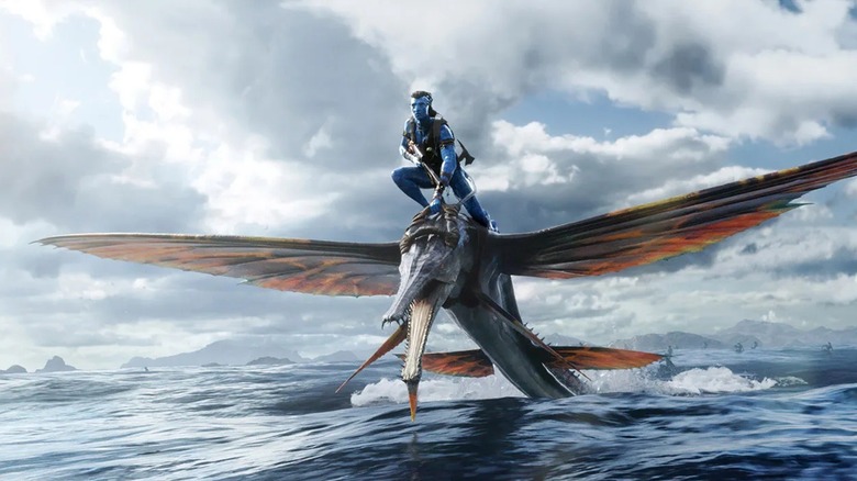Jake Sully riding water creature into skirmish in Avatar: The Way of Water (2022)