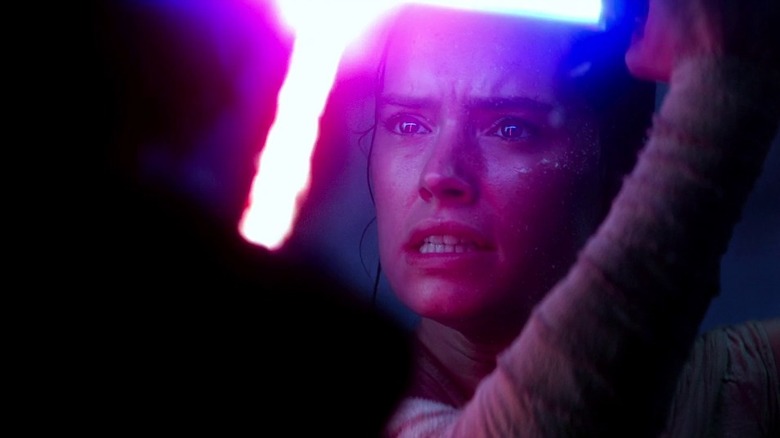 Rey dueling Kylo Ren in Star Wars: The Force Awakens (2015)