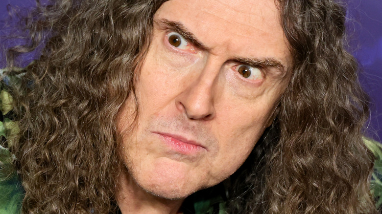 Al Yankovic making weird face at the premiere of Weird