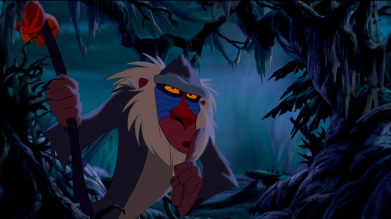 Rafiki with his finger to his lips gesturing to be quiet