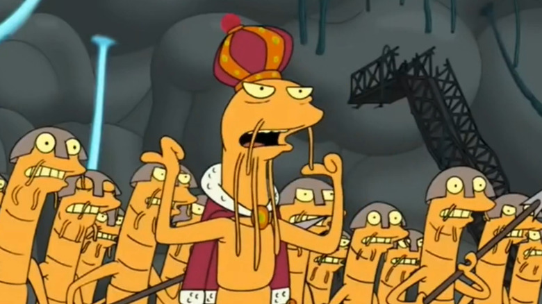 The Parasite King holding his hands up while wearing a crowd, flanked by an army of parasite warriors, in "Futurama"