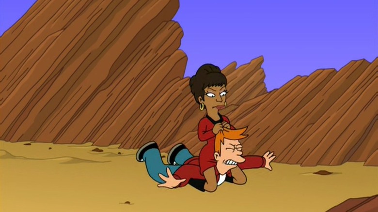 Nichelle Nichols pinning Fry to the ground while pulling on his hair in "Futurama"