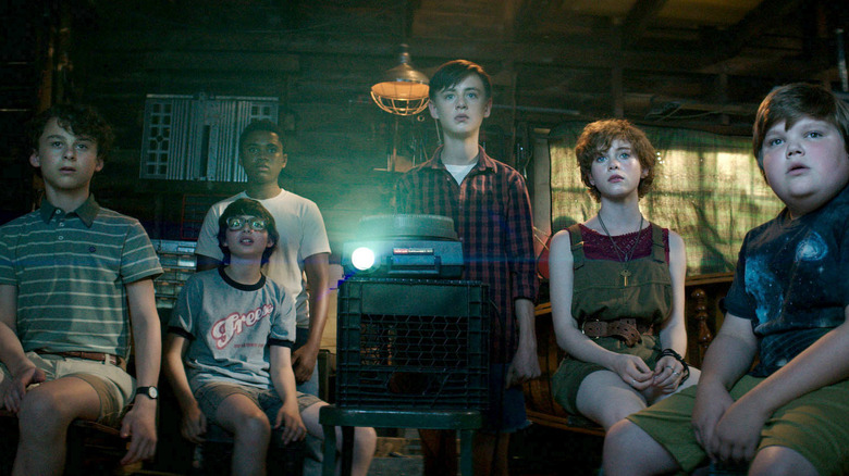 The kids watching a projector