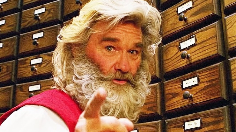 Kurt Russell as Santa pointing