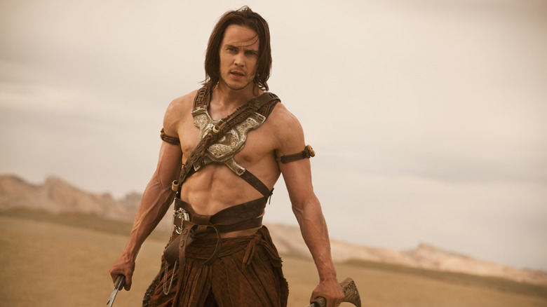 John Carter standing with battle-ready expression