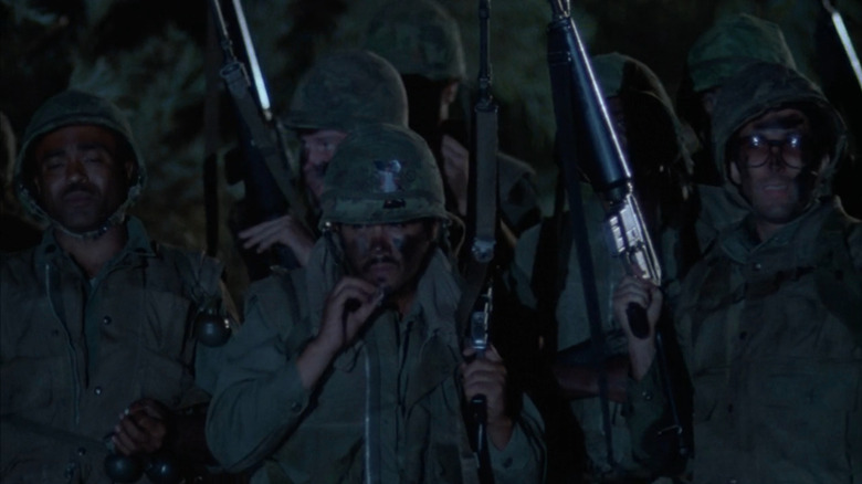 American soldiers walking through the jungle in Vietnam in Twilight Zone: The Movie