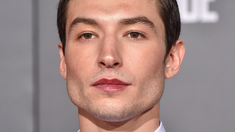 Ezra Miller posing at a premiere