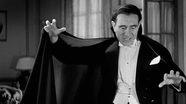   Carlos Villarías as Dracula menacing his prey